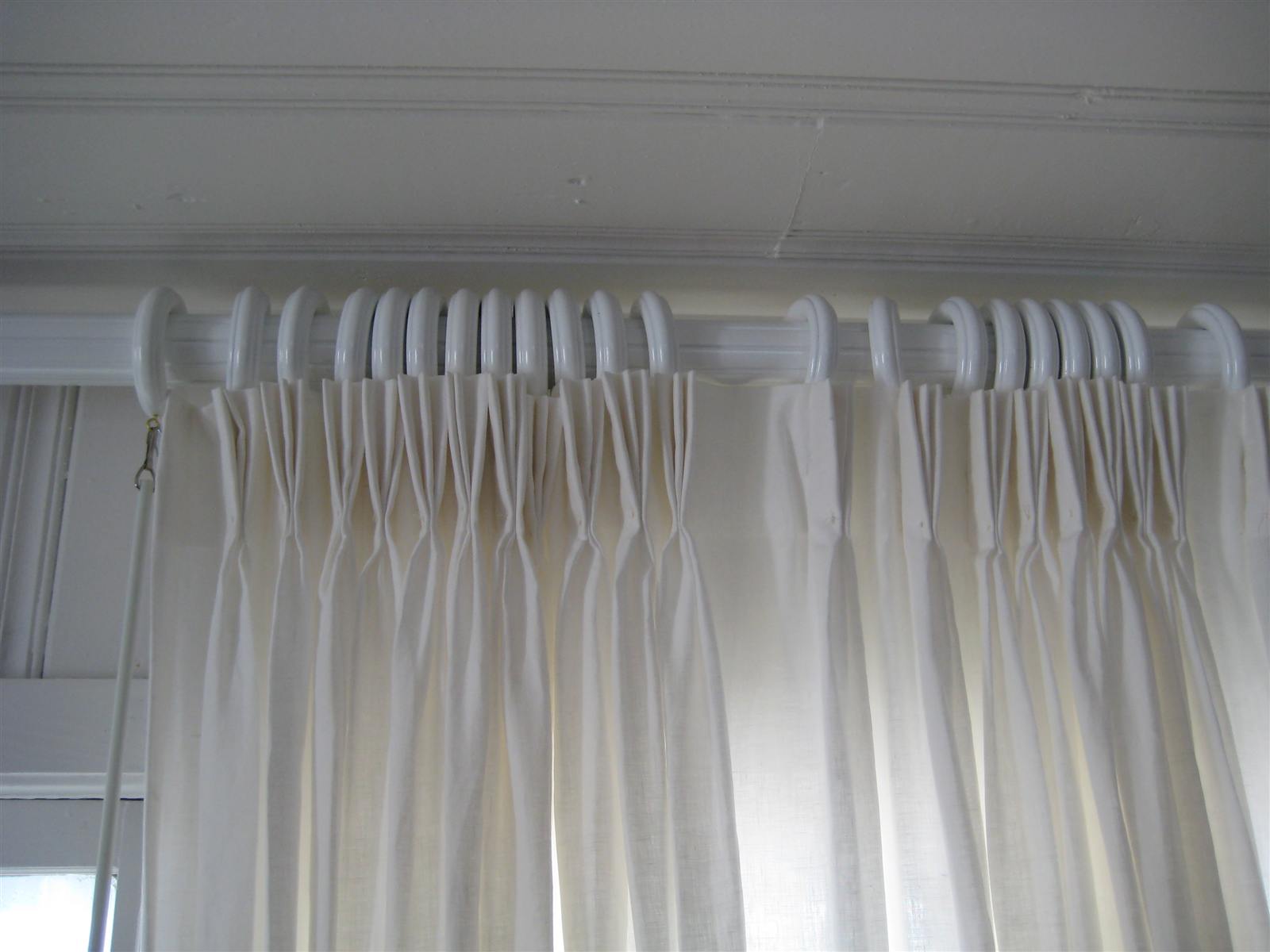 Soft daylight through layered window curtains